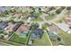 Aerial view of houses with pools in backyards, neighborhood streets, and community layout at 2410 Sweetwater Blvd, St Cloud, FL 34772