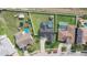 Overhead shot showcasing backyard pools, well-kept lawns, and surrounding neighborhood at 2410 Sweetwater Blvd, St Cloud, FL 34772