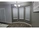 Breakfast nook features three windows that provide natural lighting, grey walls, and wood-look floors at 2410 Sweetwater Blvd, St Cloud, FL 34772