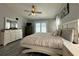 Spacious bedroom with sliding glass doors and pool views, complemented by stylish furnishings at 2410 Sweetwater Blvd, St Cloud, FL 34772