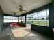 Enjoy this large screened patio with tile flooring, ceiling fans, and views of the pool at 2410 Sweetwater Blvd, St Cloud, FL 34772