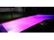 Backyard pool at night with purple LED lighting at 2410 Sweetwater Blvd, St Cloud, FL 34772