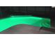 Backyard pool at night with green LED lighting at 2410 Sweetwater Blvd, St Cloud, FL 34772