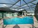 Relax in your screened pool with ample deck and patio space and views of the yard at 2410 Sweetwater Blvd, St Cloud, FL 34772