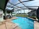 Enjoy this beautiful screened in pool, with a water feature, and ample space for recreation at 2410 Sweetwater Blvd, St Cloud, FL 34772