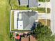 Aerial view of the home featuring the backyard paver patio and proximity to neighbors at 2454 Quail Run N Blvd, Kissimmee, FL 34744