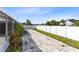 Backyard with grass and a stone paver area at 2454 Quail Run N Blvd, Kissimmee, FL 34744