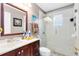 Bathroom featuring a vanity with drawers and a glass enclosed tiled shower at 2454 Quail Run N Blvd, Kissimmee, FL 34744