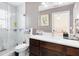 Bathroom featuring a vanity with a mirror and a glass enclosed tiled shower at 2454 Quail Run N Blvd, Kissimmee, FL 34744