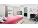 Comfortable bedroom with natural light, featuring a private en-suite bathroom at 2454 Quail Run N Blvd, Kissimmee, FL 34744