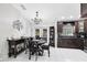 Cozy dining area with dark wood furniture and a view of the gourmet kitchen at 2454 Quail Run N Blvd, Kissimmee, FL 34744