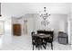 Bright dining area with tile floors and access to other living spaces at 2454 Quail Run N Blvd, Kissimmee, FL 34744