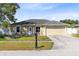 Charming home with a well-manicured lawn, attached two-car garage, and beautiful front yard at 2454 Quail Run N Blvd, Kissimmee, FL 34744