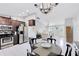 Open-concept kitchen with stainless steel appliances and sightlines to the living room at 2454 Quail Run N Blvd, Kissimmee, FL 34744