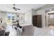 Inviting living area with a decorative front door and an open view to the bathroom at 2454 Quail Run N Blvd, Kissimmee, FL 34744
