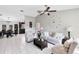 Bright living room featuring neutral tones, tile flooring, and elegant furnishings at 2454 Quail Run N Blvd, Kissimmee, FL 34744