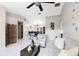 Spacious living room with tile flooring, featuring an open layout to the dining area at 2454 Quail Run N Blvd, Kissimmee, FL 34744
