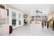 Sunroom featuring tile floors, glass windows, and a ceiling fan at 2454 Quail Run N Blvd, Kissimmee, FL 34744