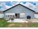 Back exterior featuring a patio area, sliding glass door, and a grill at 2507 Talega Dr, St Cloud, FL 34772