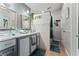 Updated bathroom features double sinks, vessel sinks, modern fixtures, and glass shower at 2507 Talega Dr, St Cloud, FL 34772
