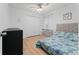Bright bedroom features a ceiling fan, patterned bedspread, and a closet at 2507 Talega Dr, St Cloud, FL 34772