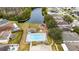 Aerial view of a community pool, playground, and lake at 2507 Talega Dr, St Cloud, FL 34772