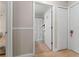 Hallway view leading to a bathroom with a marble shower curtain at 2507 Talega Dr, St Cloud, FL 34772