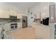 Kitchen boasts stainless appliances, tile backsplash, granite counters, and light wood-look flooring at 2507 Talega Dr, St Cloud, FL 34772