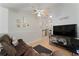 Inviting living room features wood-look flooring, a ceiling fan, and neutral paint at 2507 Talega Dr, St Cloud, FL 34772