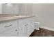 Bathroom with vanity and sink, featuring wood-look tile floors at 2621 Amati Dr, Kissimmee, FL 34741