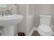 Bathroom with pedestal sink and coordinating fixtures at 2621 Amati Dr, Kissimmee, FL 34741