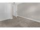 Neutral bedroom features plush carpeting and closet storage space at 2621 Amati Dr, Kissimmee, FL 34741