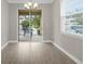 Bright dining area with sliding doors to outdoor space and ample natural light at 2621 Amati Dr, Kissimmee, FL 34741