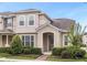 Beautifully landscaped home with a covered entryway and well-manicured bushes at 2621 Amati Dr, Kissimmee, FL 34741
