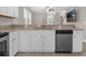Well-lit kitchen features granite countertops and stainless steel appliances at 2621 Amati Dr, Kissimmee, FL 34741