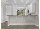 Breakfast bar showcases the kitchen's open design and ample storage at 2621 Amati Dr, Kissimmee, FL 34741