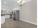 Spacious eat-in kitchen with stainless steel refrigerator and ample lighting at 2621 Amati Dr, Kissimmee, FL 34741