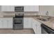 The bright kitchen showcases stainless steel appliances and ample storage at 2621 Amati Dr, Kissimmee, FL 34741