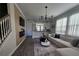 Open-concept living area with contemporary design, chic furnishings, and natural light at 2621 Amati Dr, Kissimmee, FL 34741