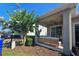 Relaxing covered patio with modern outdoor furniture and ceiling fan for comfortable outdoor living at 2621 Amati Dr, Kissimmee, FL 34741