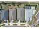 Aerial view of three homes with pools and well-maintained landscaping at 2679 Ridgetop Ln, Clermont, FL 34711