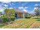 Wide backyard with green grass, patio, and well-maintained landscaping at 2679 Ridgetop Ln, Clermont, FL 34711