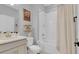 Bathroom with vanity, toilet, and shower-tub combination with neutral curtain at 2679 Ridgetop Ln, Clermont, FL 34711