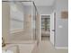 Bathroom showcasing a glass shower, and view into the main bedroom at 2679 Ridgetop Ln, Clermont, FL 34711