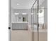 Modern bathroom features double sinks, bathtub, and glass shower at 2679 Ridgetop Ln, Clermont, FL 34711