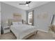 Bedroom with bed and bedside table with natural light from the window at 2679 Ridgetop Ln, Clermont, FL 34711