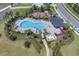 Overhead view of the community pool featuring a unique design and ample lounging space at 2679 Ridgetop Ln, Clermont, FL 34711