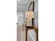 Stylish entryway featuring a wooden console table with lamp, a large mirror, and light wood flooring at 2679 Ridgetop Ln, Clermont, FL 34711