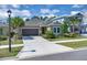 Charming single-story home with a well-manicured lawn and a two-car garage at 2679 Ridgetop Ln, Clermont, FL 34711