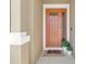 Inviting front door with a 'hello' mat and potted plants, creating a warm welcome at 2679 Ridgetop Ln, Clermont, FL 34711